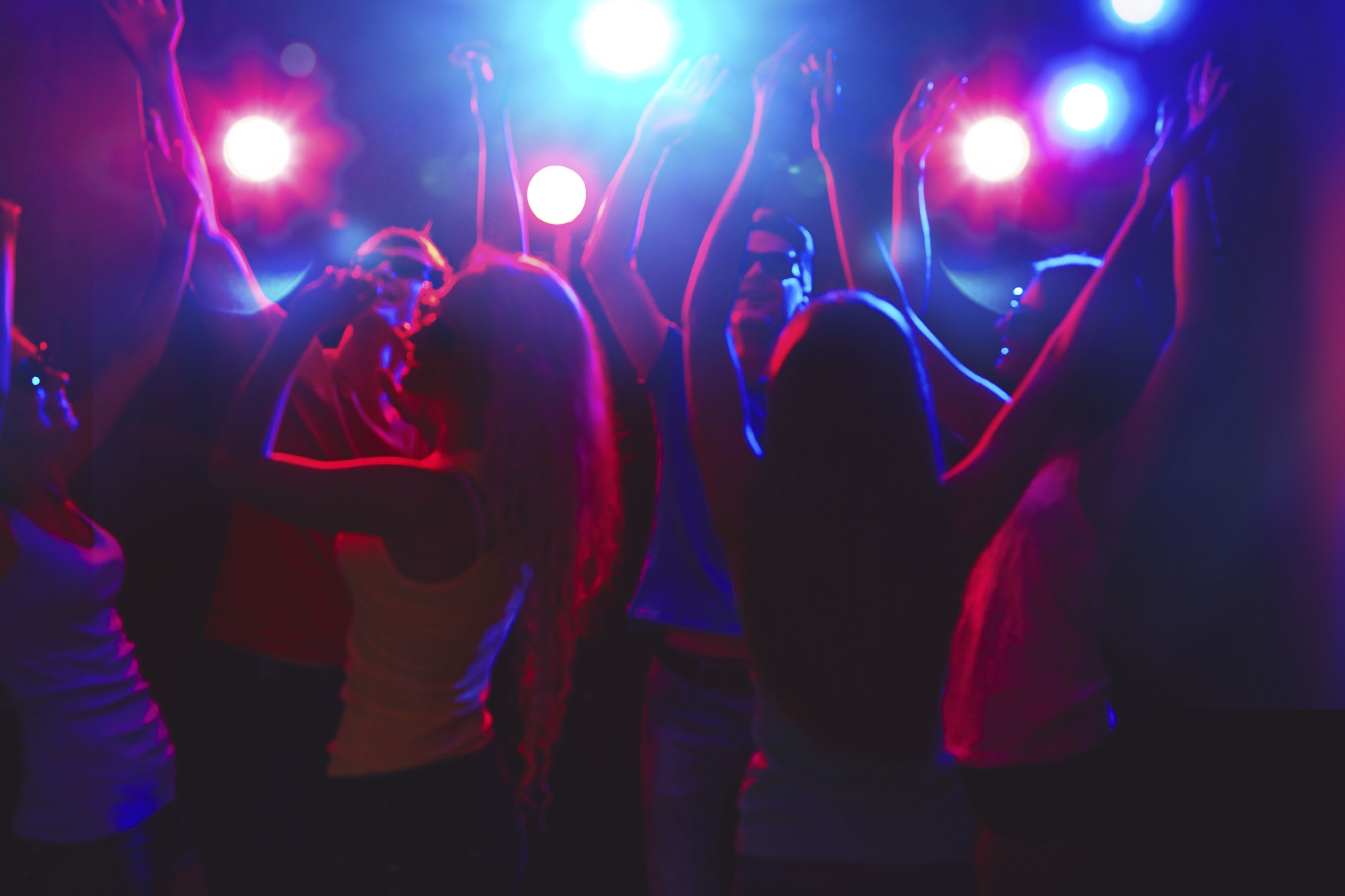 Young people having fun dancing at party.